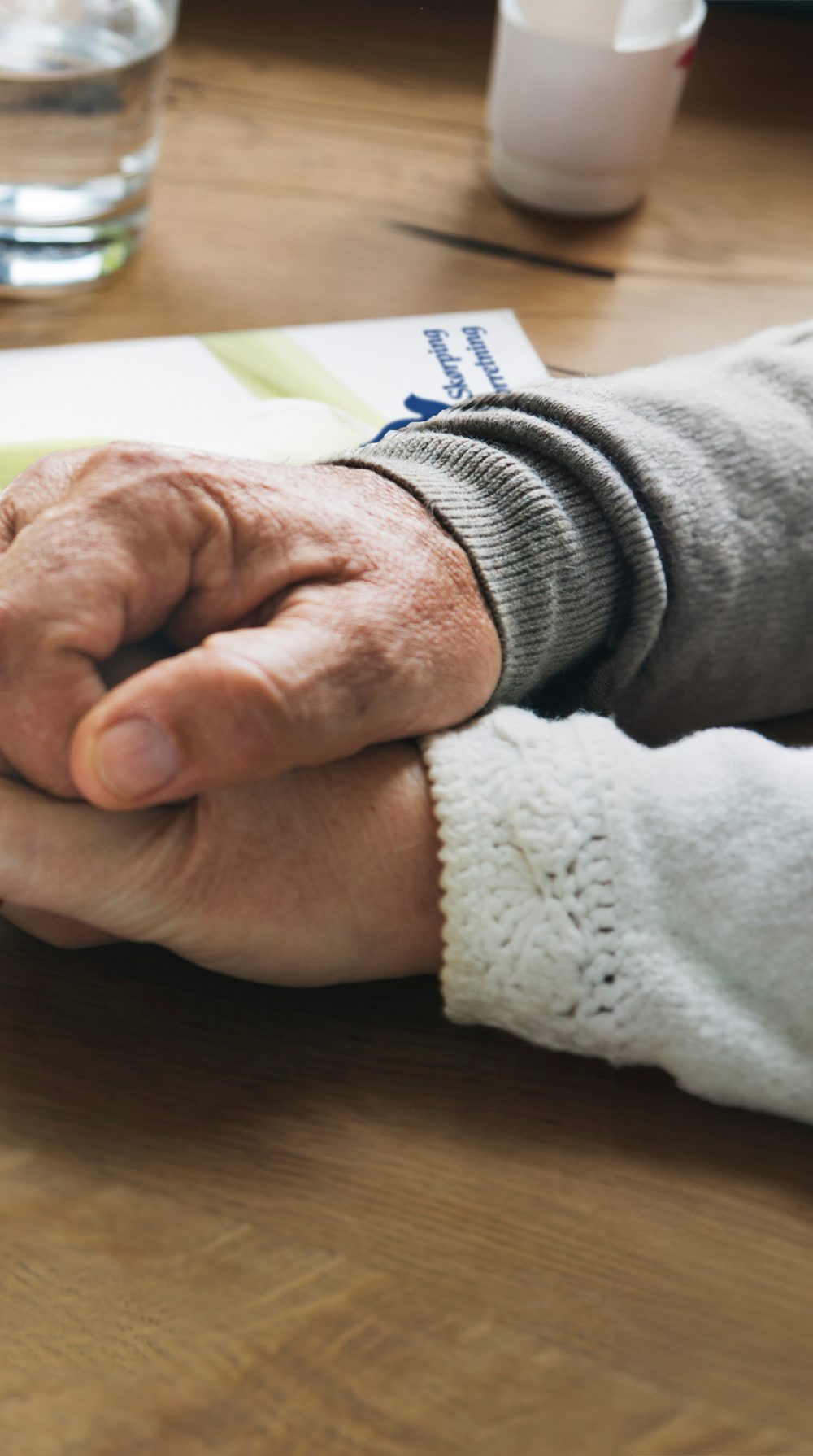 Senior married coupple comforting each other and holding hands Senior married coupple comforting each other and holding hands